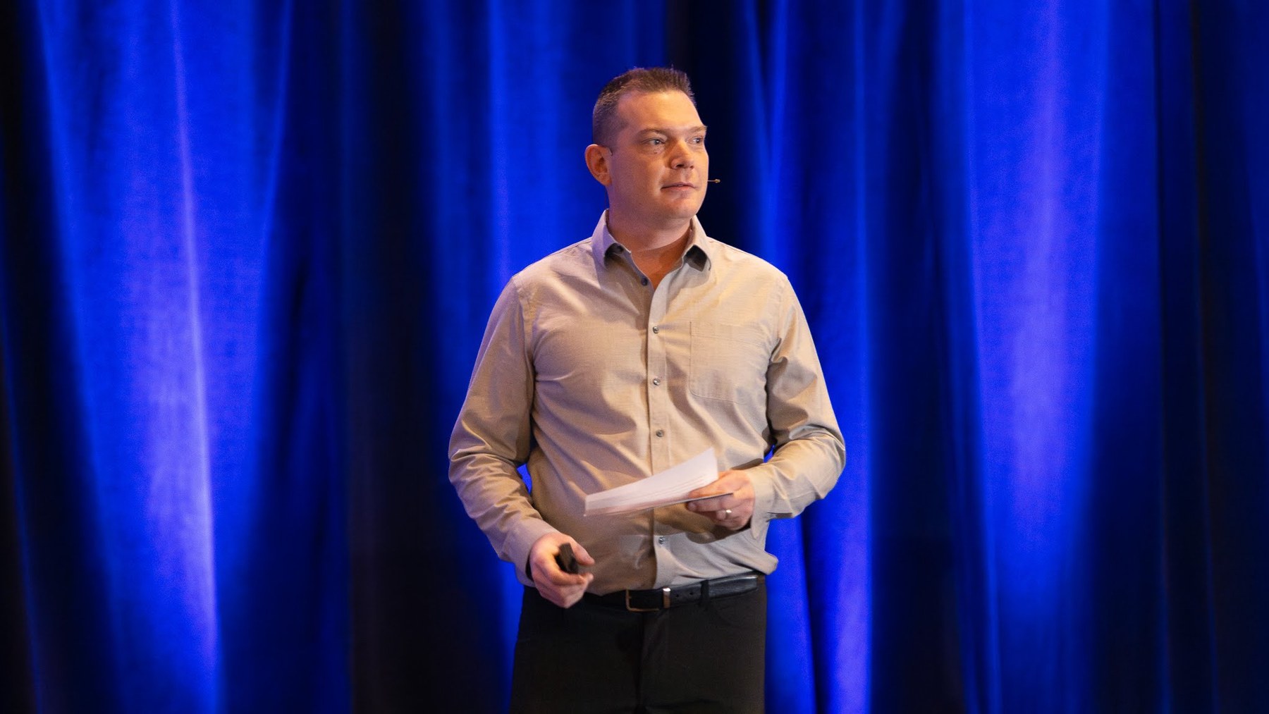 Richard Canfield speaking on stage